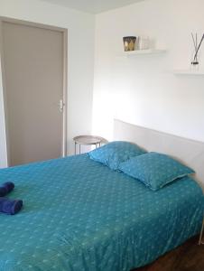 Ένα ή περισσότερα κρεβάτια σε δωμάτιο στο Le Nid Charolais