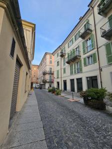 an empty street in a city with buildings at Ca' Tecla in Asti