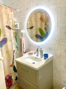 a bathroom with a sink and a mirror at La casita del oso in Linares de la Sierra