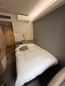 Postel nebo postele na pokoji v ubytování Hotel Tetora Spirit Sapporo - Vacation STAY 59365v