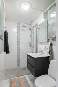 a bathroom with a sink and a toilet at Home in Vingåker in Vingåker +17 photos