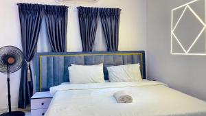 Ένα ή περισσότερα κρεβάτια σε δωμάτιο στο 7th generation apartments