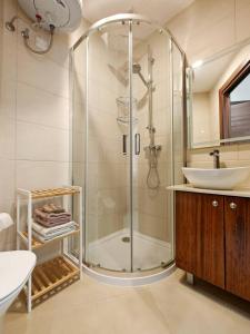 a bathroom with a shower and a sink at Valley View 2 in Luqa +24 photos