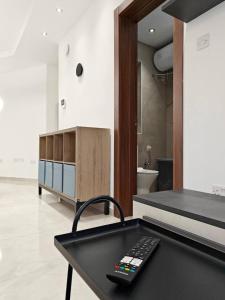a remote control sitting on a table in a kitchen at Valley View 1 in Luqa +24 photos