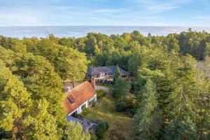 an aerial view of a house in the woods at Architect-Designed Holiday Home Close To The Water in Marielyst