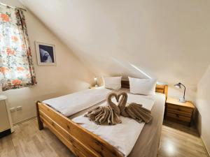 a bedroom with a bed with two towels on it at FH Butt in Blengow +18 photos