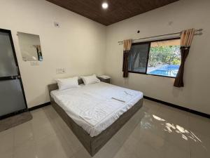 Postel nebo postele na pokoji v ubytování The Dreams of Kathiyawad