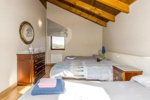 Ένα ή περισσότερα κρεβάτια σε δωμάτιο στο Casa Rural Ucedo