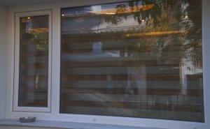 a glass door of a house with a window at Tinas Studio in Thessaloniki