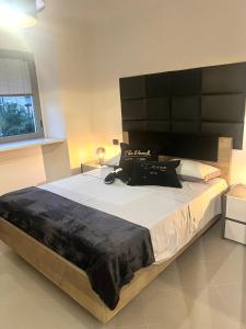 Ένα ή περισσότερα κρεβάτια σε δωμάτιο στο Royal Relax Sarzana +22 φωτογραφίες