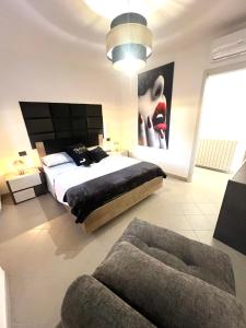 Ένα ή περισσότερα κρεβάτια σε δωμάτιο στο Royal Relax Sarzana