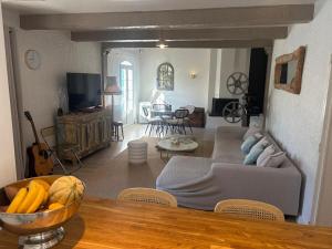 a living room with a couch and a table at 3 Bedroom 2 Bath Villa Private Pool in Mougins in Mougins