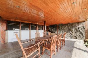 a dining room with a table and chairs at Gita Inn Bali RedPartner in Denpasar