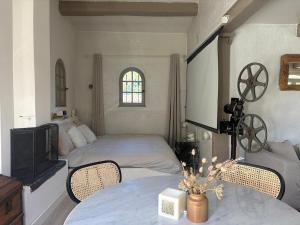 a bedroom with two beds and a tv and a table at 3 Bedroom 2 Bath Villa Private Pool in Mougins in Mougins +7 photos