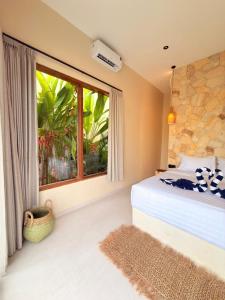 Ένα ή περισσότερα κρεβάτια σε δωμάτιο στο Villa Saraswati II