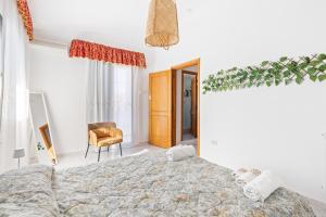Ένα ή περισσότερα κρεβάτια σε δωμάτιο στο Casa Cossu