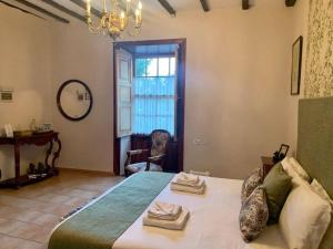 a bedroom with a bed with two towels on it at Ziggy's Mountain Retreat in Vilaflor +104 photos