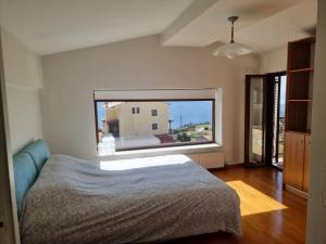 Postel nebo postele na pokoji v ubytování Monte horizon - By Ski Alure