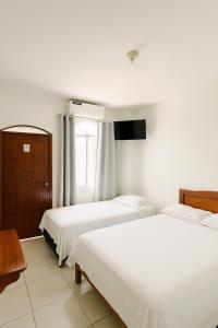 Postel nebo postele na pokoji v ubytování Hotel Pedernales MrRobert