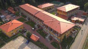 an overhead view of a building with an orange roof at Ostseepark in Zempin
