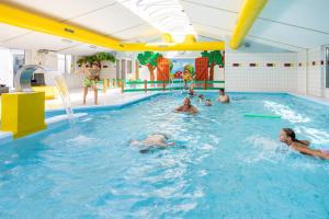 a group of people in a swimming pool at Siblu Camping in de Bongerd in Oostkapelle