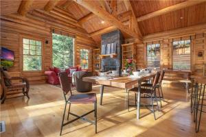 a dining room with a table and chairs in a cabin at RMR: Granite Ridge Cabin 7586 in Teton Village in Teton Village