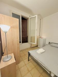 Ένα ή περισσότερα κρεβάτια σε δωμάτιο στο Maison Bon Séjour