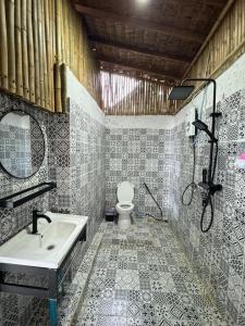 a bathroom with a sink and a toilet at Haad Chao Phao Resort in Haad Chao Phao