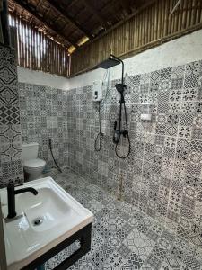 a bathroom with a sink and a shower at Haad Chao Phao Resort in Haad Chao Phao +63 photos