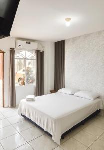 Ένα ή περισσότερα κρεβάτια σε δωμάτιο στο Hotel Pedernales MrRobert