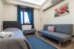 Ένα ή περισσότερα κρεβάτια σε δωμάτιο στο Venetia's Kastoria Home