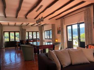 a living room with a couch and a table at Sonho No Mondego in Penacova