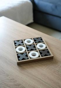 a wooden board game on a wooden table at Stobhill Apartment in Glasgow +31 photos