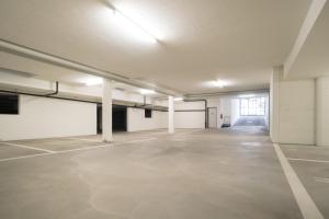 an empty parking lot in an empty parking garage at RIVER Apartment in Andermatt