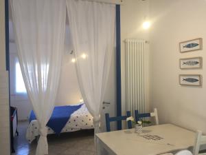 Ένα ή περισσότερα κρεβάτια σε δωμάτιο στο Agriturismo La Contadina Appartamenti