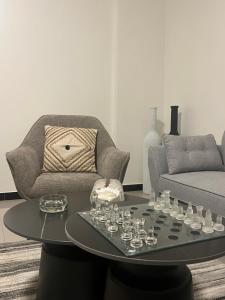 a living room with a table and a couch at Farid Street - Studio - Dakar Plateau in Dakar