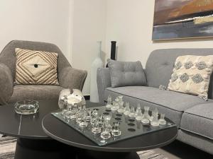 a living room with a couch and a coffee table at Farid Street - Studio - Dakar Plateau in Dakar