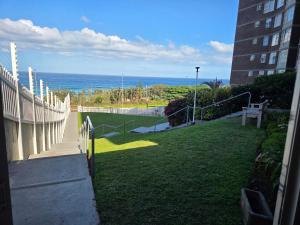 a view of the ocean from a balcony of a building at Peacehaven Beachfront Property - Scottburgh KZN in Scottburgh