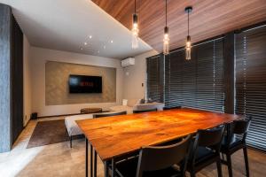 TV a/nebo společenská místnost v ubytování JANUS villa Furano