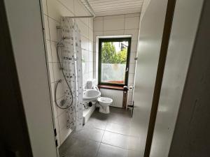 Koupelna v ubytování Hotel Grünewald chs + 13 fotografií