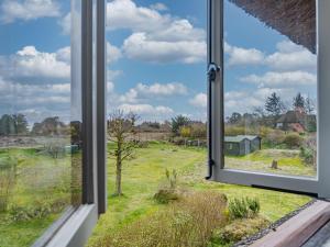 an open window with a view of a field at Haus-Fahnert-1 in Kampen
