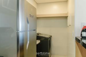 Η κουζίνα ή μικρή κουζίνα στο Aptos em Prédio com Piscina e Academia - GRL +1 φωτογραφίες