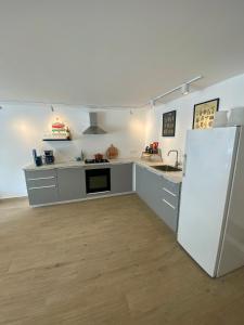 Kuchyň nebo kuchyňský kout v ubytování Sobremesa Boutique