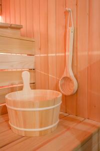 a wooden tub in a kitchen with a wooden spoon at Apartment Cocosinella in Surčin +24 photos