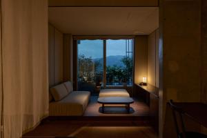 Una cama o camas en una habitación de KÚON Hakone Gora