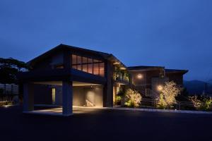 a house at night with the lights on at KÚON Hakone Gora in Hakone
