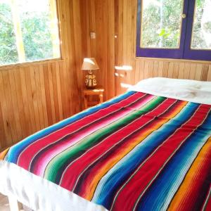 Ένα ή περισσότερα κρεβάτια σε δωμάτιο στο El albardon