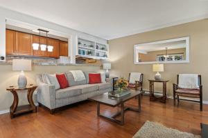 a living room with a couch and a table at RMR: Foxtail 5113 Condo in The AspensWilsonWY in Wilson
