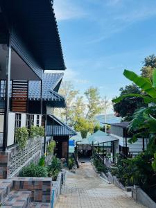 a building with a walkway in front of it at Real Koh Rong in Koh Rong