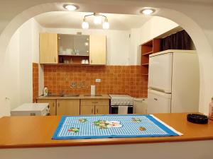 a kitchen with a table with a towel on it at Elixir studio in Bucharest